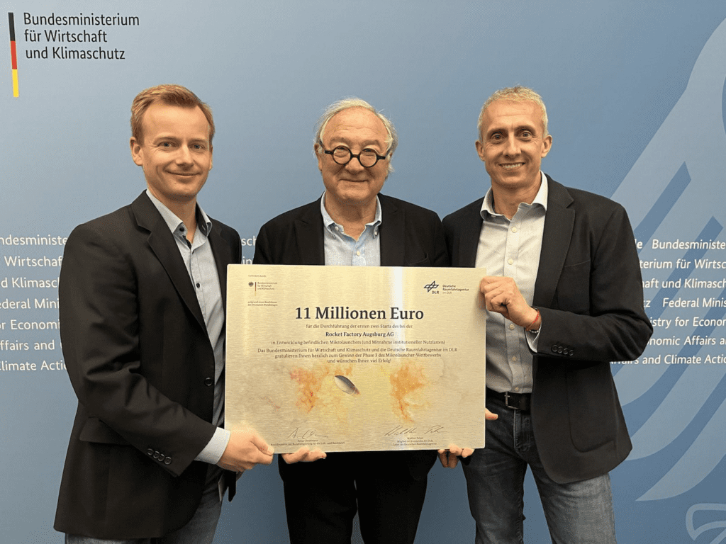 image of CEOs of RFA and DLR holding signed deal over 11 million euros for the first two flights of RFA ONE