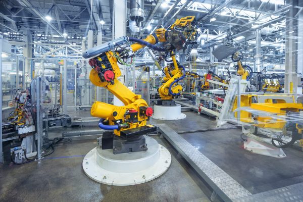 robotic arms in a car plant